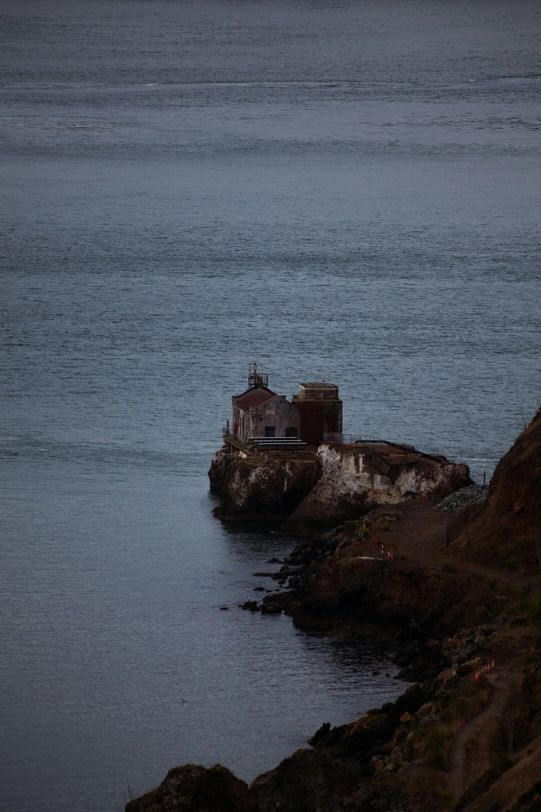 Quiet fishing village lighthouse on a peninsula at dusk
